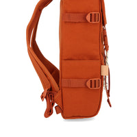 General shot of side slip pockets on Topo Designs Rover Pack Mini Backpack in clay canvas.