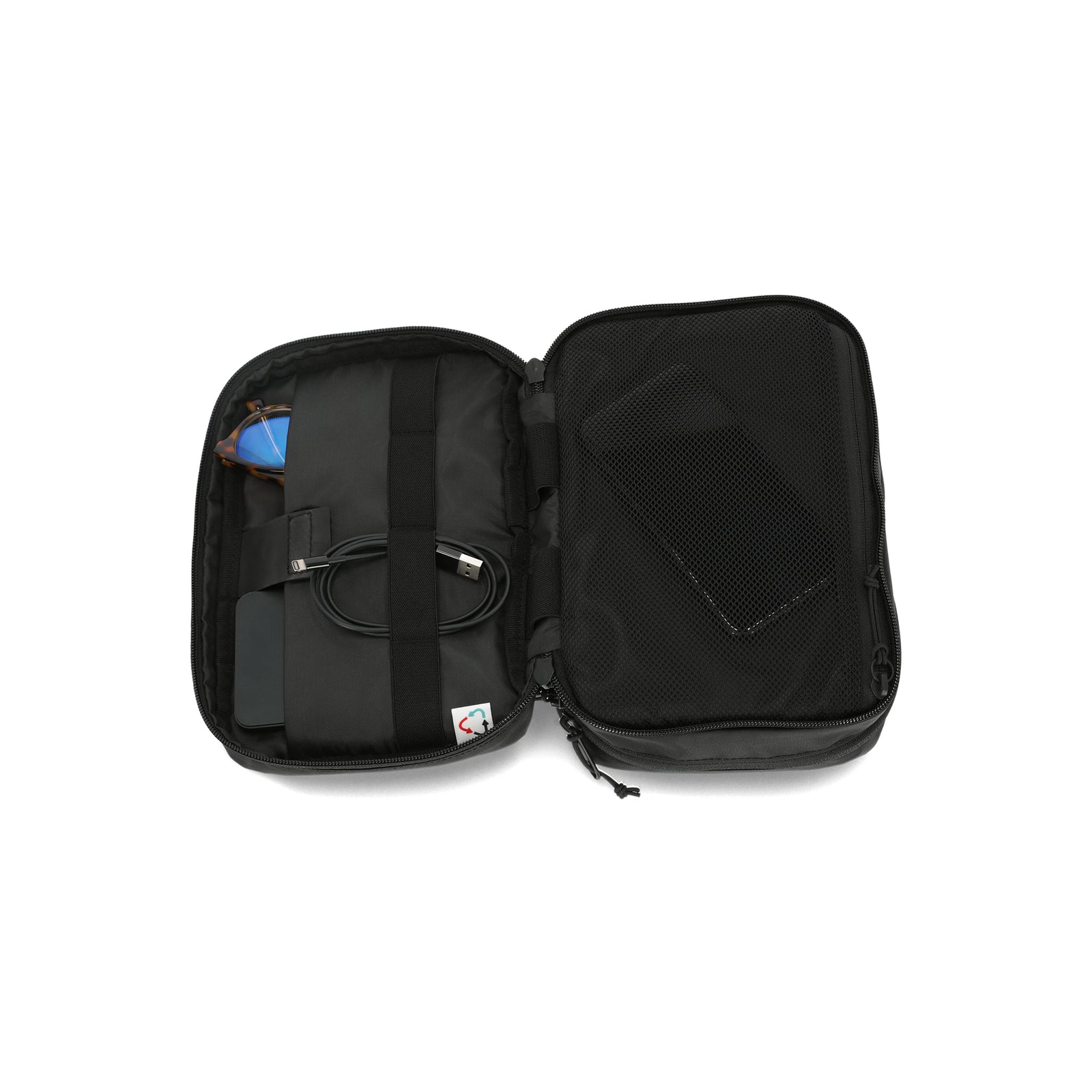 General shot of inside pockets of Topo Designs Tech electronics organization travel Case in black recycled nylon.