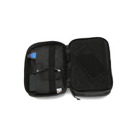 General shot of inside pockets of Topo Designs Tech electronics organization travel Case in black recycled nylon.