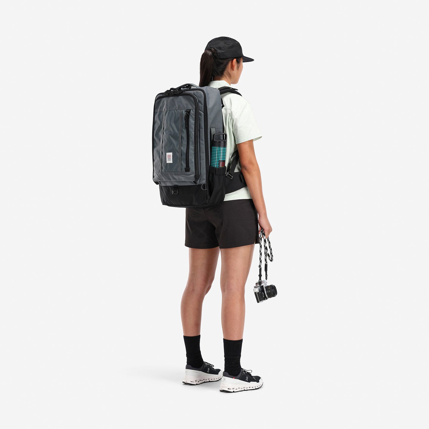 Topo Designs x Miir Water Bottle in "Black Grid" in outer pocket of global travel bag.  