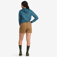 General back shot of model wearing Topo Designs Women's Mountain Shorts in organic cotton dark khaki brown.