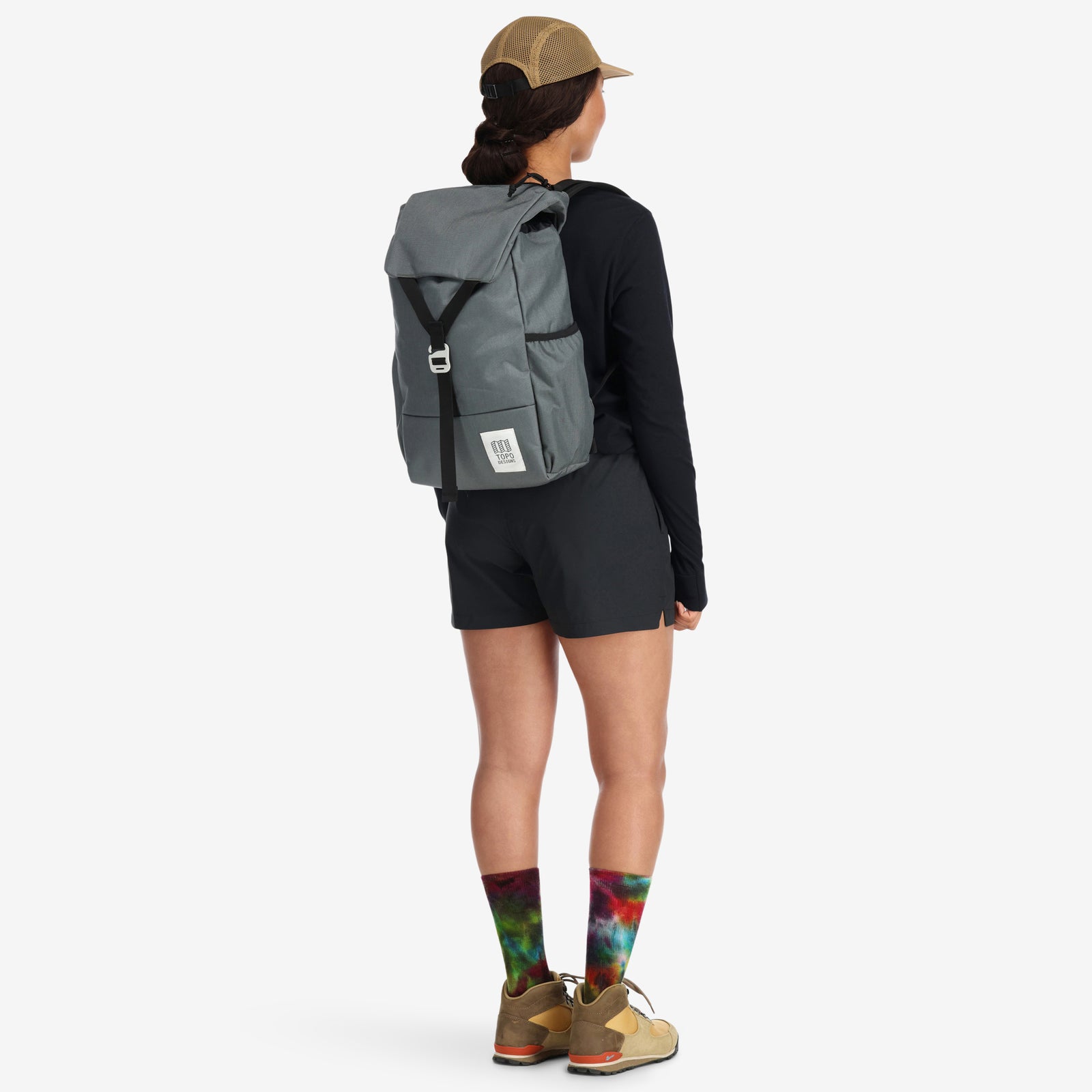 General shot of Topo Designs Y-Pack hiking backpack in charcoal gray on model.