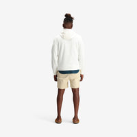 On model shot of Topo Designs Men's Dirt Hoodie 100% organic cotton French terry sweatshirt in "natural" white.