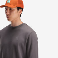 General front, neck model shot of Topo Designs Men's Dirt Crew sweatshirt in 100% organic cotton in "charcoal" grey.