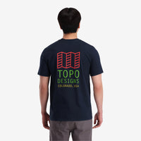 On model back view of Topo Designs Men's Small Original Logo Tee 100% organic cotton short sleeve graphic logo t-shirt in "navy" blue.