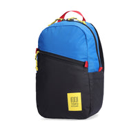 Side view of Topo Designs Light Pack in recycled "Black / Blue" nylon.