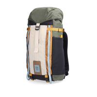 Side view of Topo Designs Mountain Pack 16L hiking backpack with internal laptop sleeve in lightweight recycled nylon "Bone White / Olive".