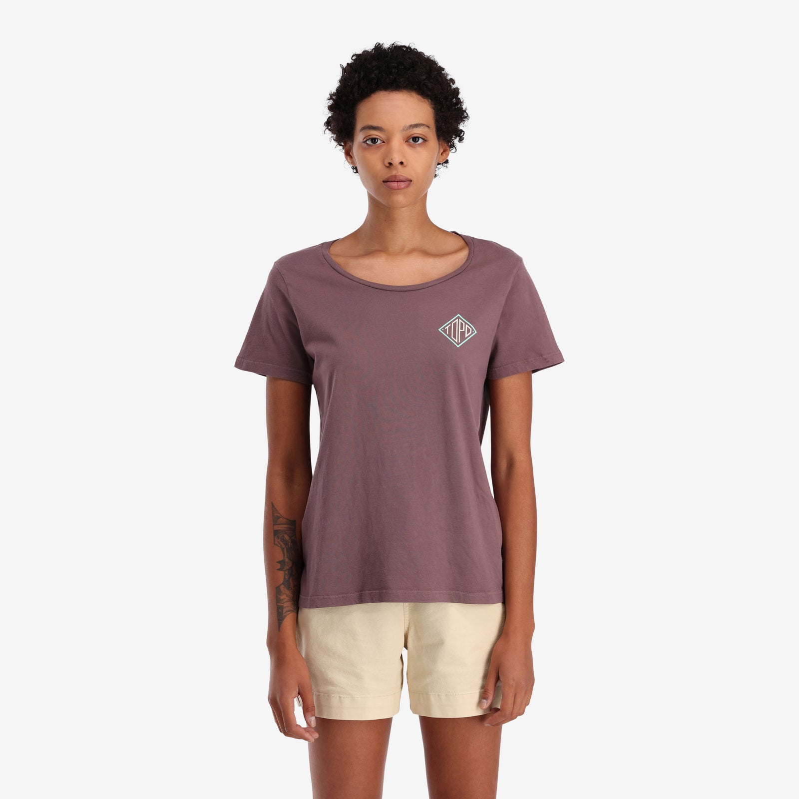On model front view of Topo Designs Women's Small Diamond Tee 100% organic cotton short sleeve graphic logo t-shirt in "peppercorn" purple brown.