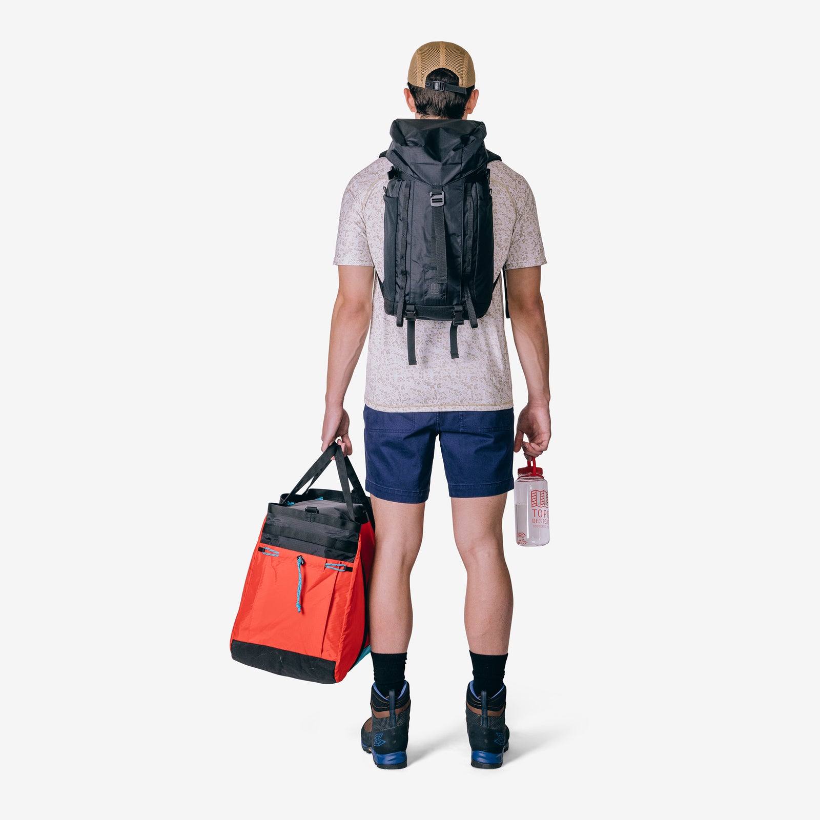 Back model shot of Topo Designs Mountain Pack 16L hiking backpack with internal laptop sleeve in lightweight recycled nylon "black".