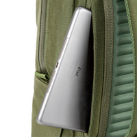 General shot of external laptop sleeve access on side of Topo Designs Daypack Tech 100% recycled nylon backpack in "Olive" green.