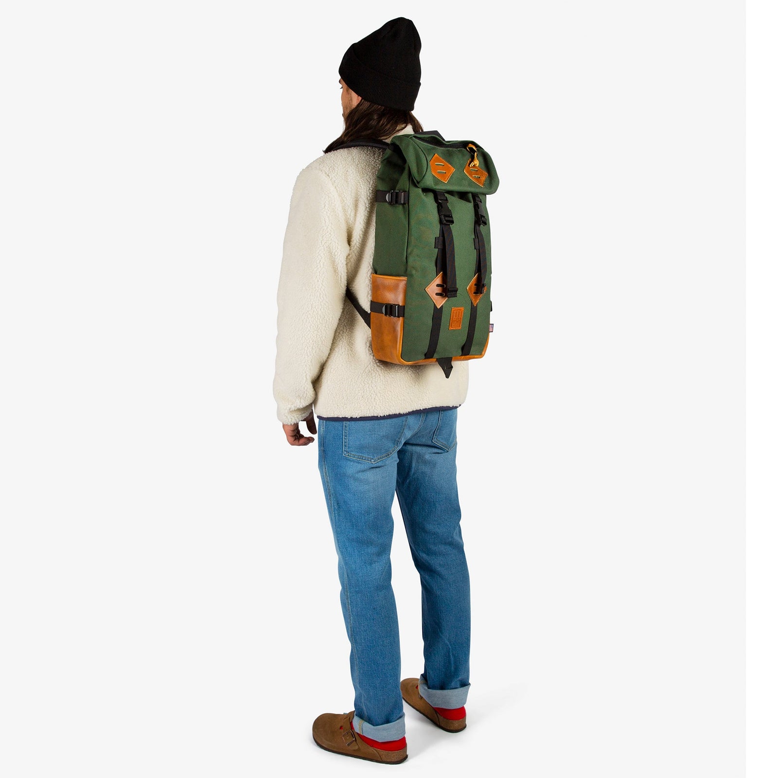 General shot of Topo Designs Klettersack Heritage Canvas backpack in Olive green Canvas / Brown Leather on model.
