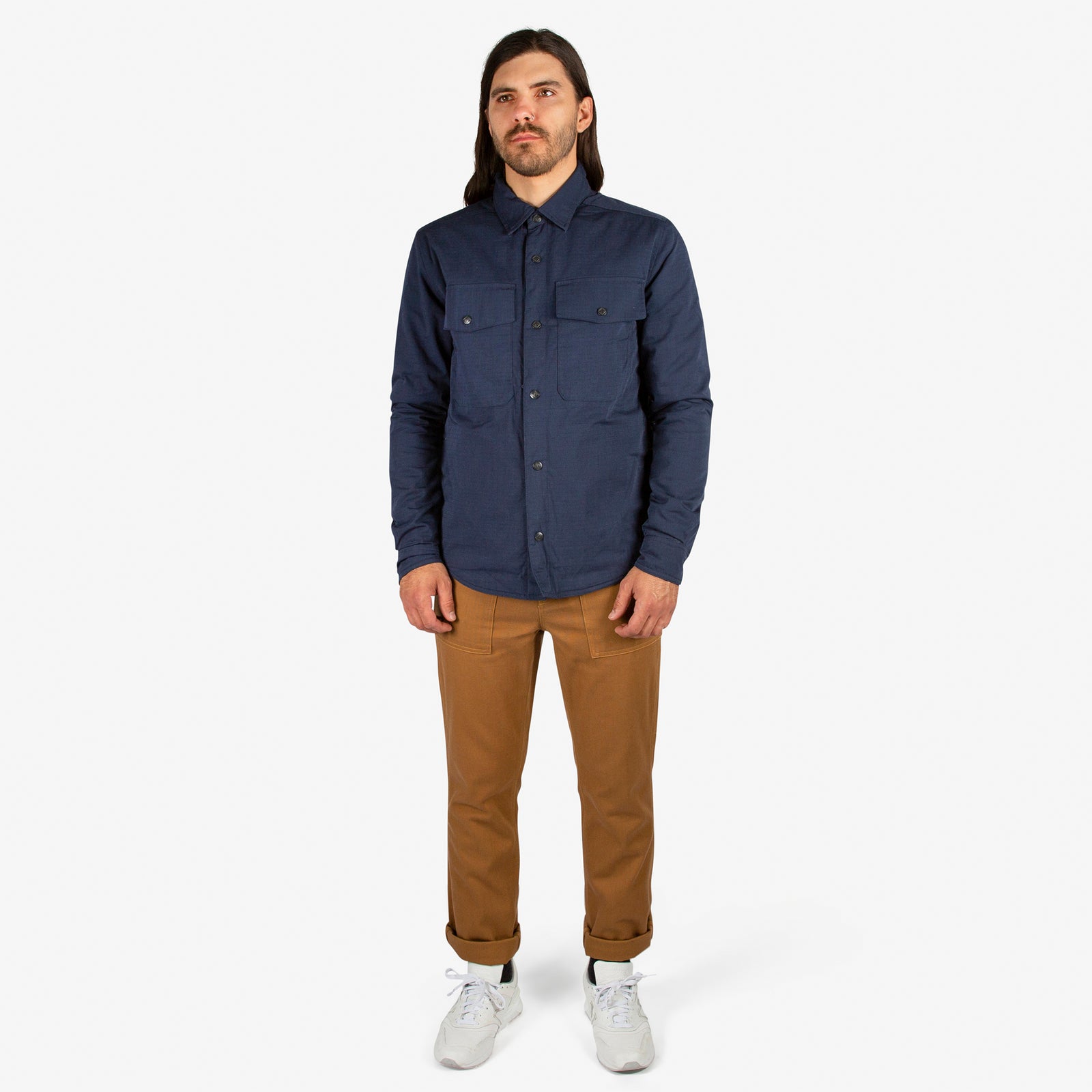 General front model shot of Men's Topo Designs Insulated Shirt Jacket in Navy blue.