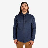 General close-up front model shot of Men's Topo Designs Insulated Shirt Jacket in Navy blue.