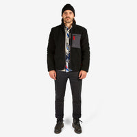 Front model shot of Topo Designs Men's Sherpa Jacket in "Black" showing sherpa fleece side.