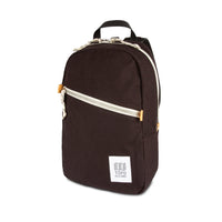 3/4 front product shot of Topo Designs Light Pack in "Black" canvas.