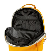General top detail shot of Topo Designs Light Pack in Mustard yellow canvas showing black lining and laptop sleeve.