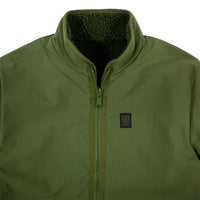 General detail shot of Topo Designs Men's Sherpa Jacket in Olive green showing DWR side, collar, zipper, and chest logo patch.