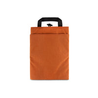 Back pocket on Topo Designs padded Laptop Sleeve in "Clay" orange.