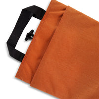 General back pocket detail shot of Topo Designs padded Laptop Sleeve in Clay orange.
