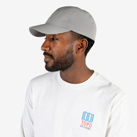 Topo Designs Tech Cap 6-panel nylon hat in "Charcoal" gray on model.