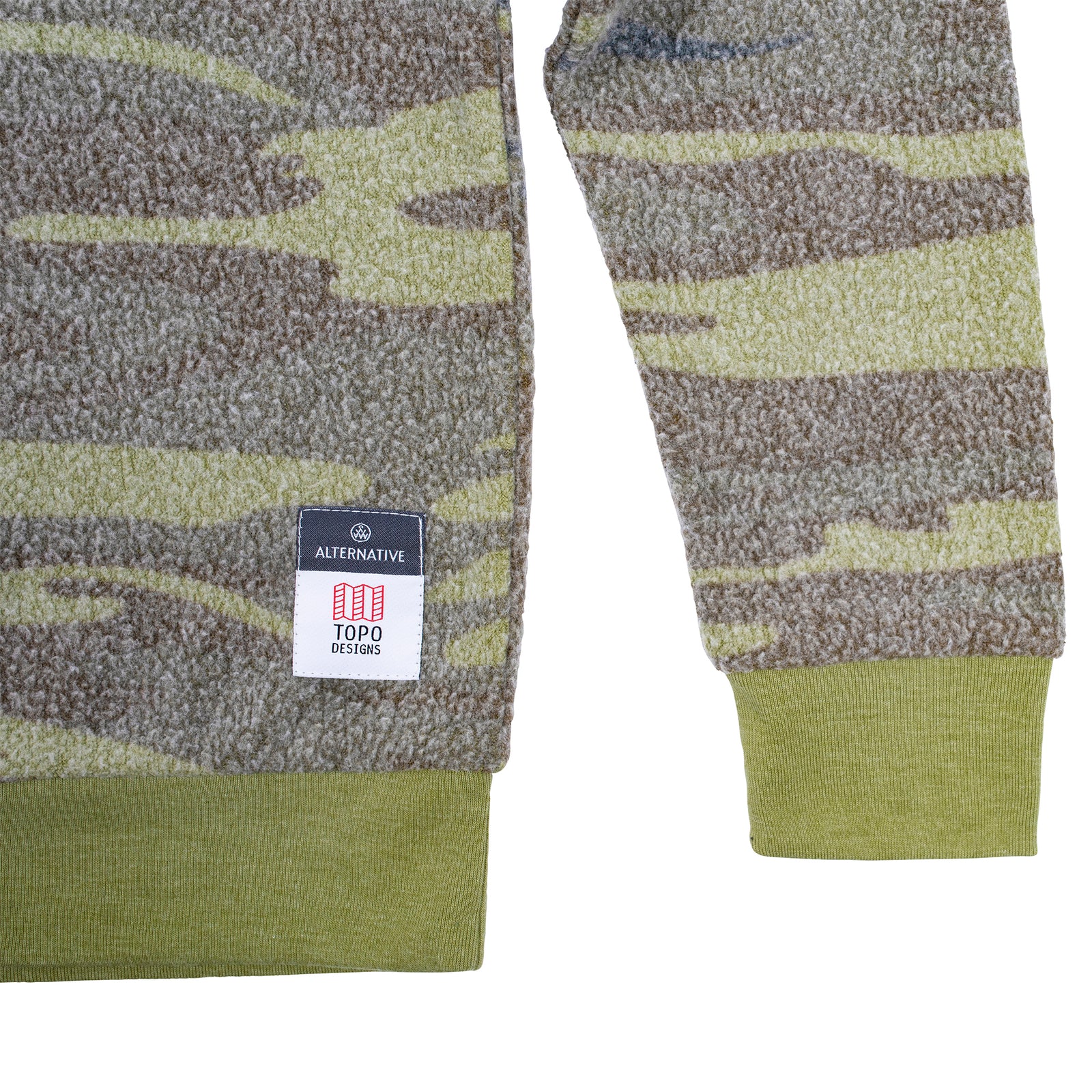 Detail shot of Topo Designs x Alternative Champ Eco-Teddy Sweatshirt - Men's in camo showing tag near bottom hem.