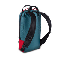 Back product shot of Topo Designs x Alternative Trip Pack in red/teal showing backpack straps