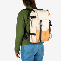 General back model shot of the Topo Designs women's sherpa jacket in "olive" green showing the DWR tech fabric side.